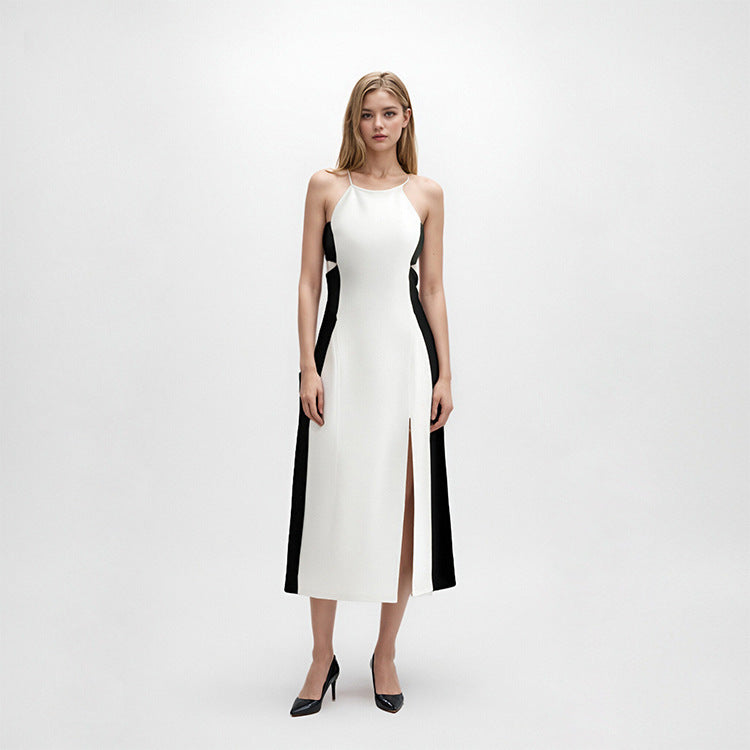 High-quality, elegant strapless, sleeveless knit dress with contrasting black and white patchwork, slimming slit, and mid-length.