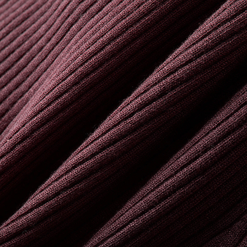 Elegant burgundy sweater with V-neck, long sleeves, and simple high-quality buttons