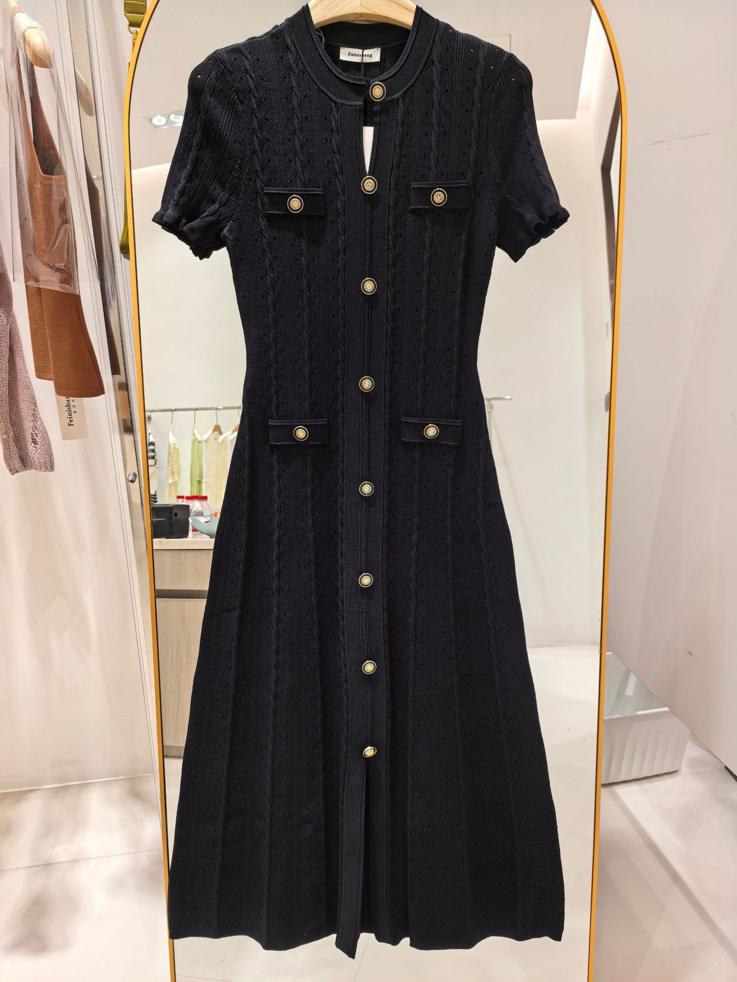 High-quality, elegant French-style dress with a round neckline, short sleeves, simple buttons, longer hem, and lace trim