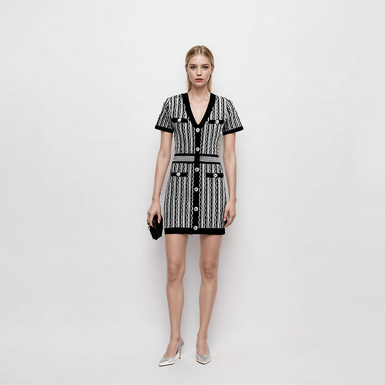 Elegant short-sleeved knit dress with V-neckline, mid-length, and simple buttons