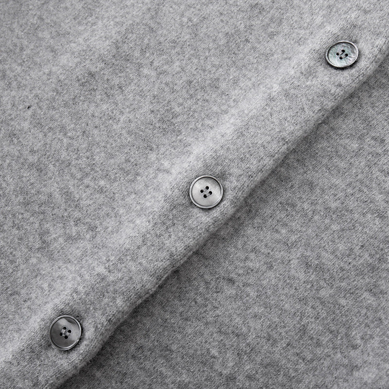 Stylish gray sweater with round neck, long sleeves, front buttons, and 100% high-quality wool