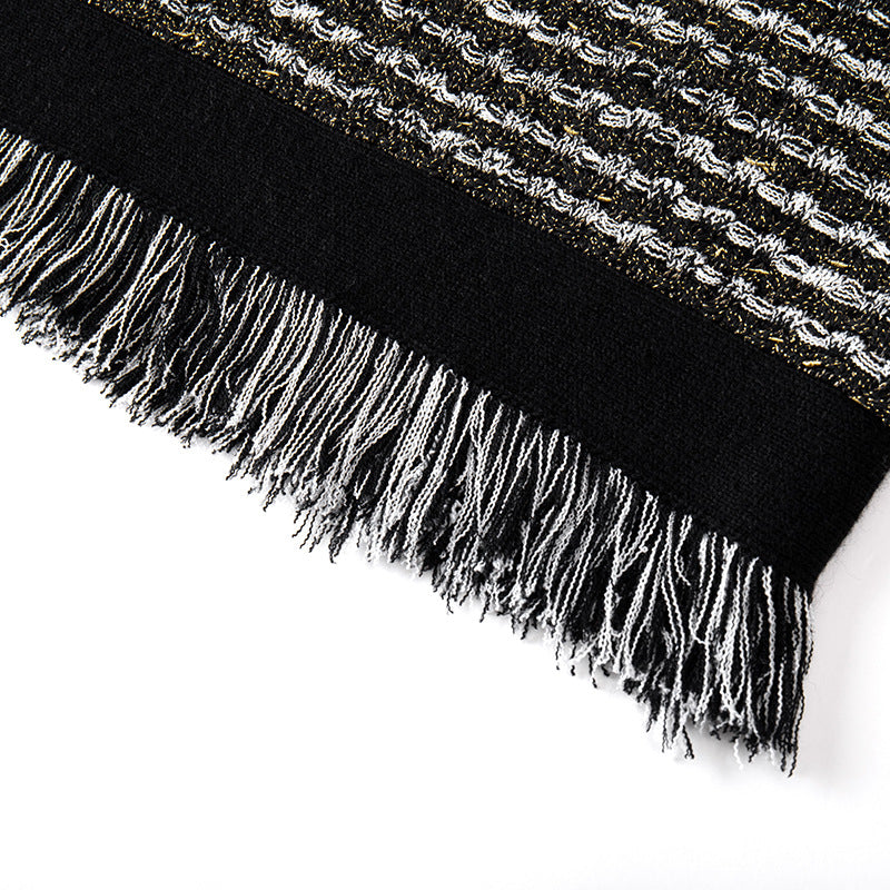 Elegant sleeveless knit dress with fringes and a round neckline in French fashion style