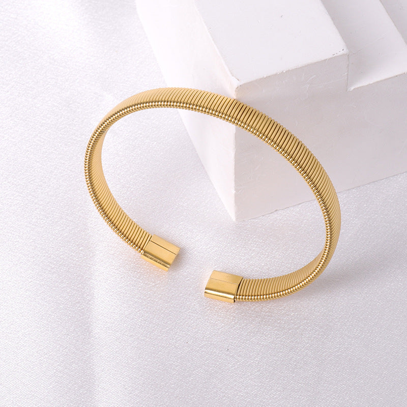 Cross border fashion stainless steel braided bracelet with high-end feel, no fading, versatile and open mouth jewelry wholesale