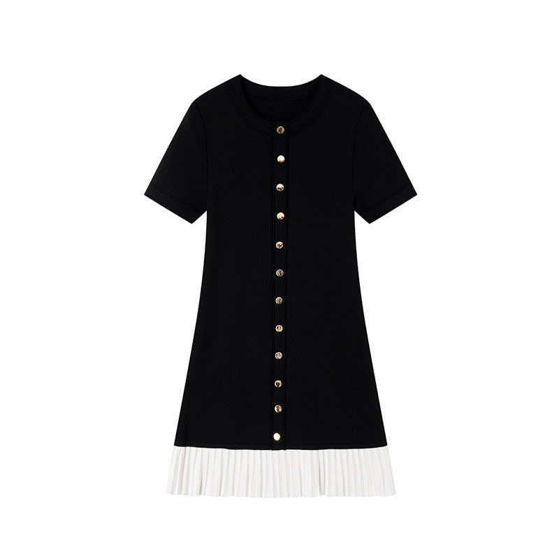 Elegant black and white French-style dress with contrasting round neckline, short sleeves, buttons, and high-quality pleats