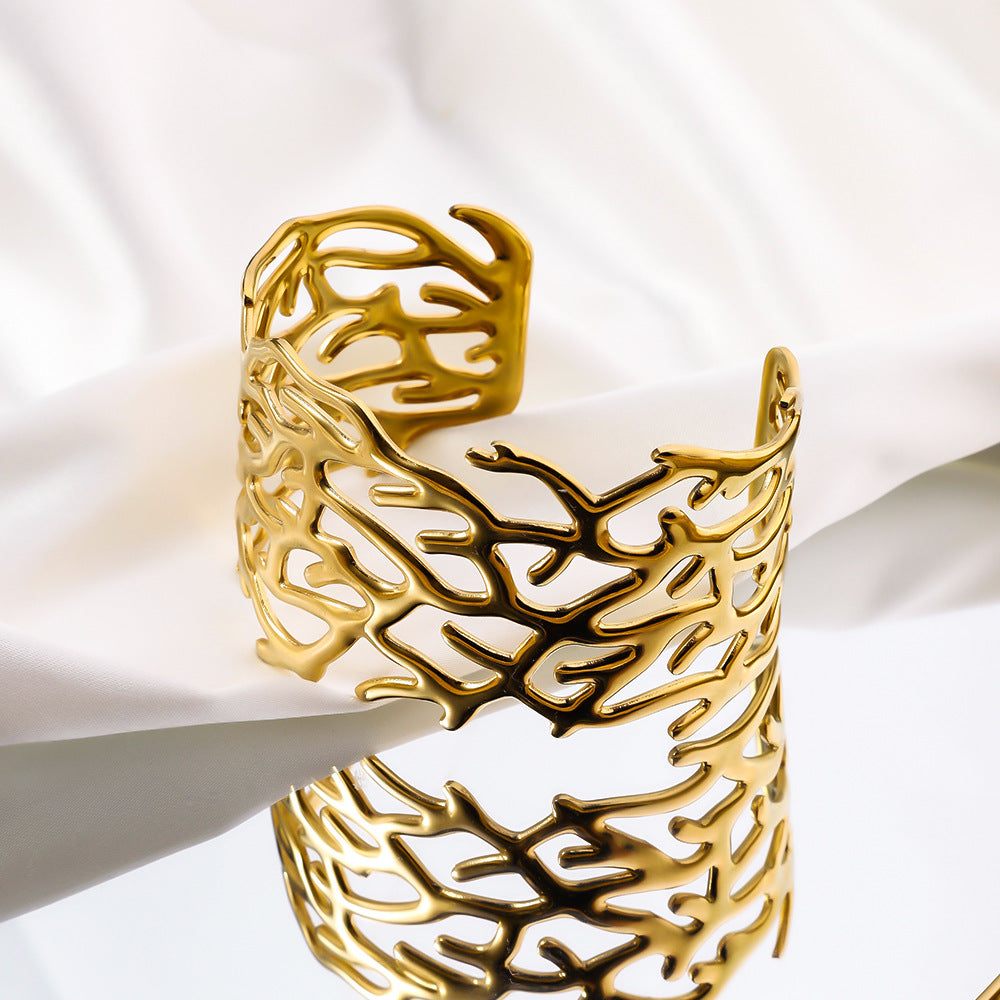Stainless steel open hydraulic bracelet, European and American women's fashionable arm ring plated with 18K real gold, cross-border hot selling titanium steel bracelet