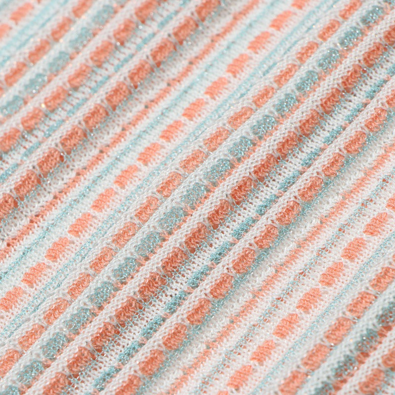 Fitted sleeveless dress with an elegant V-neckline, made from Tencel fabric with high-quality gold and silver stripes