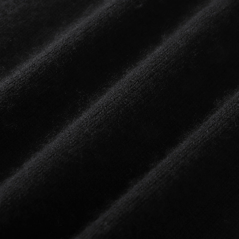 Elegant wool sweater with rhinestone print, round neckline, long sleeves, and buttons