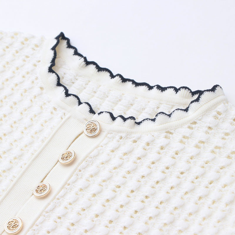 High-quality, elegant knit dress with a round neckline, short sleeves, lace details, and mid-length hem