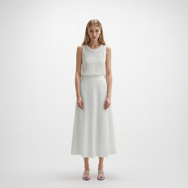 Elegant set of white lace blouse with round neckline, sleeveless, and high-quality high-waisted knit skirt