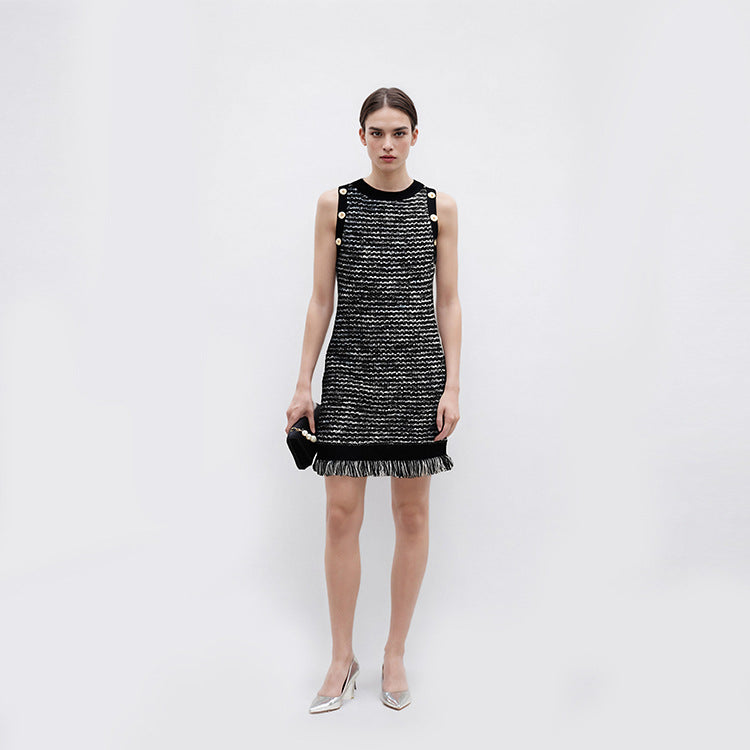 Elegant sleeveless knit dress with fringes and a round neckline in French fashion style