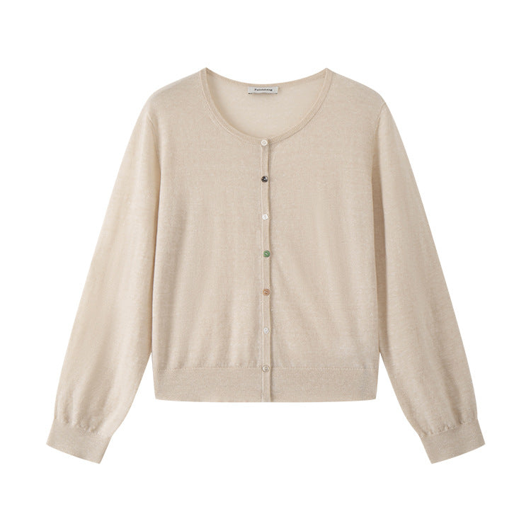 Lightweight knit jacket with a round neckline, long sleeves, and simple buttons, made from a high-quality wool and linen blend