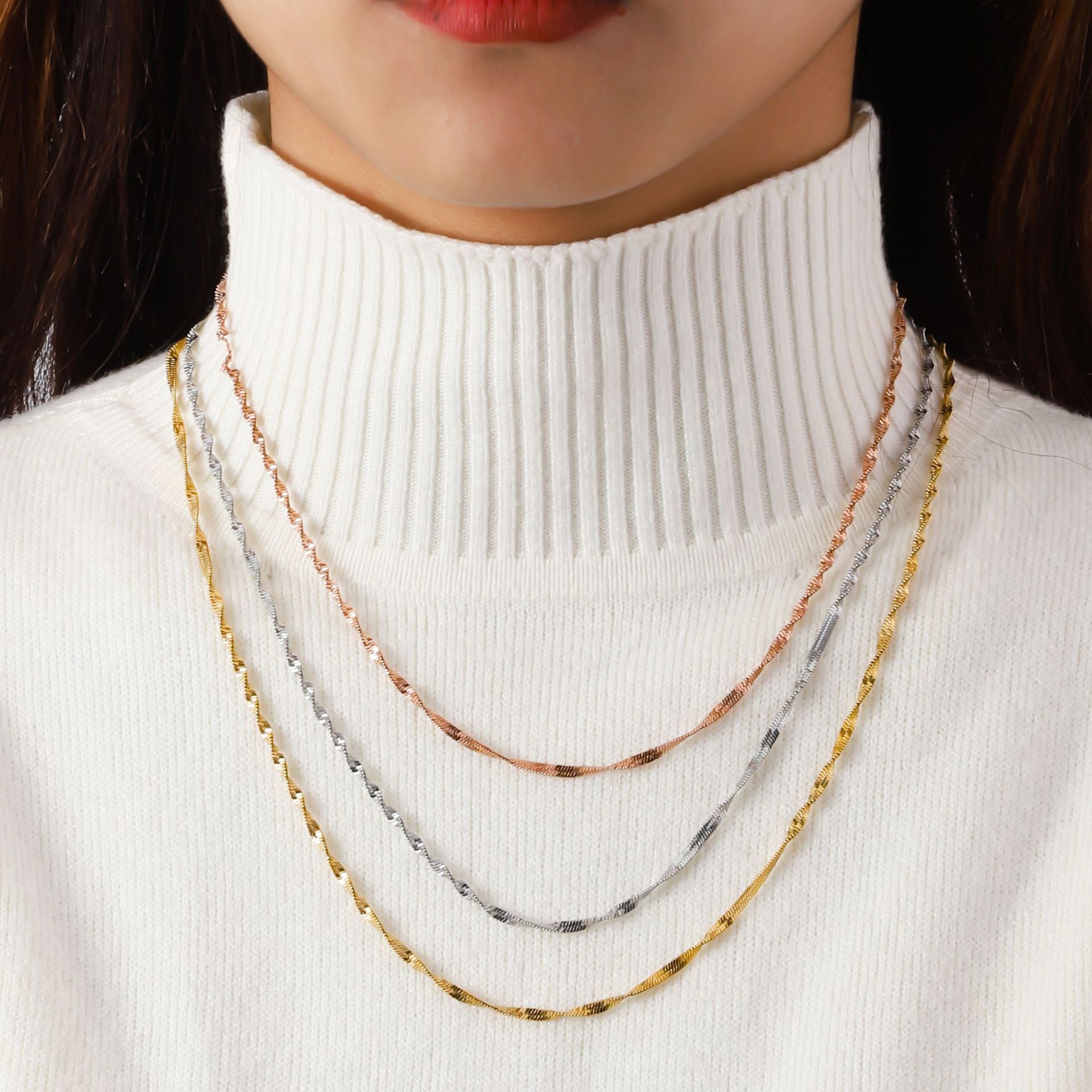 Stainless steel three-layer twisted push dense layered necklace for women, versatile plated 18K real gold lock bone chain ins titanium steel snake bone chain