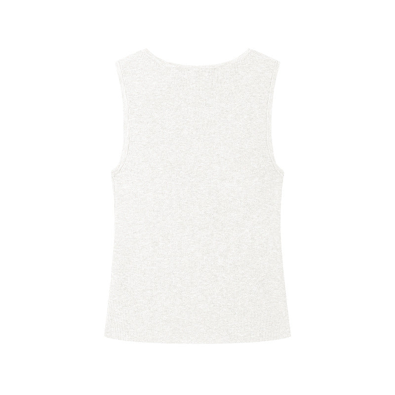 Elegant blouse with a round neckline, sleeveless, and halter neck, made from luxurious embroidered wool knit fabric.