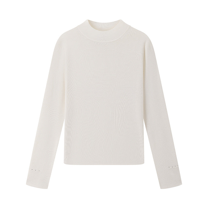 Elegant, high-quality sweater with a round neckline, slim fit, long sleeves, 100% wool, and rhinestone embellishments