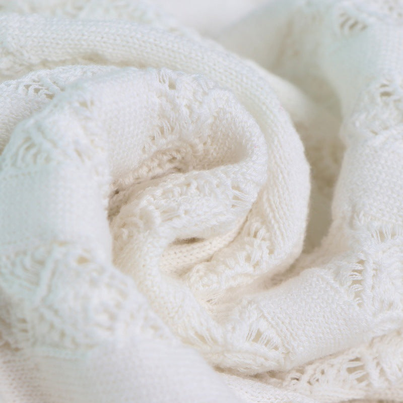 Elegant set of white lace blouse with round neckline, sleeveless, and high-quality high-waisted knit skirt