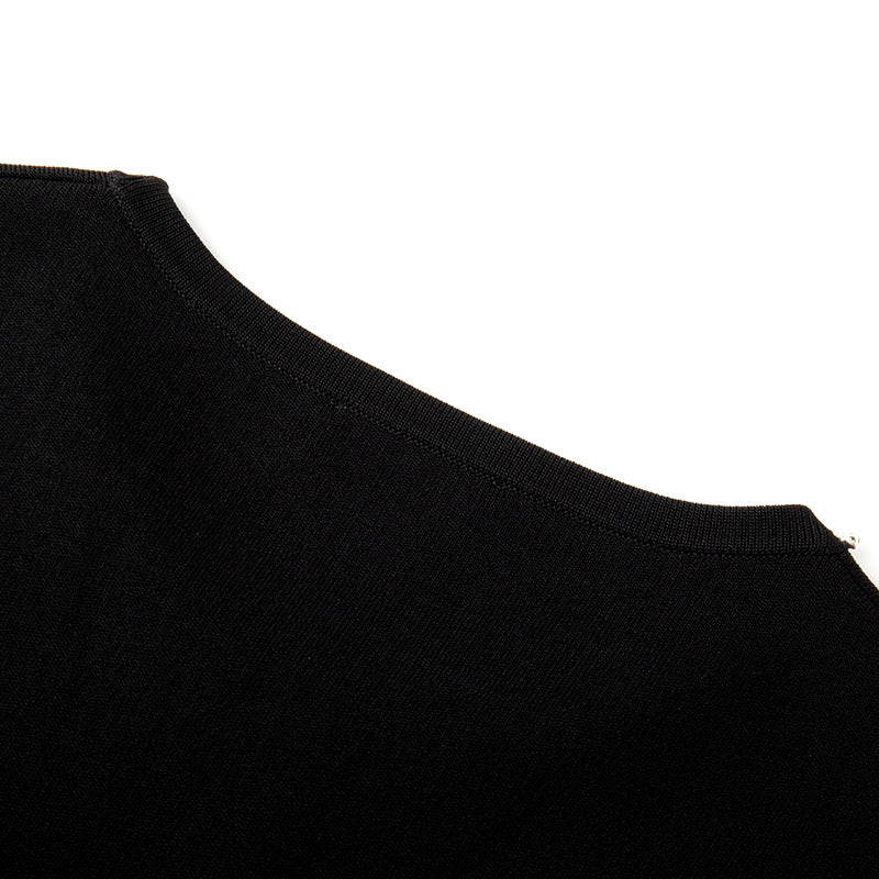 Elegant set consisting of a black sleeveless blouse with a round neckline and studs, paired with a high-waisted skirt with high-quality knit lacing