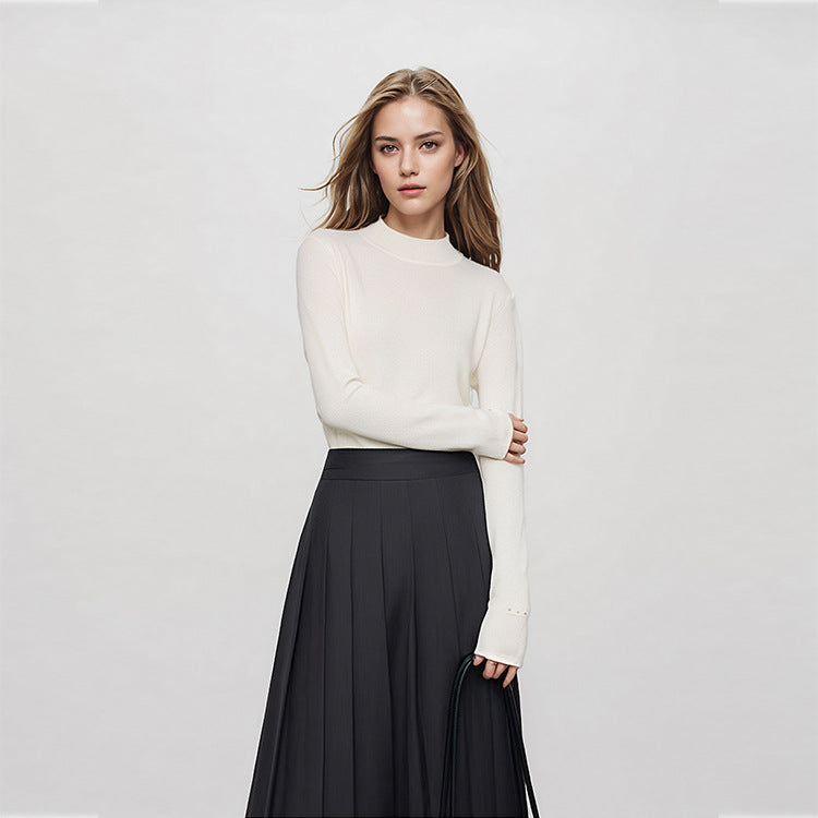 Elegant, high-quality sweater with a round neckline, slim fit, long sleeves, 100% wool, and rhinestone embellishments