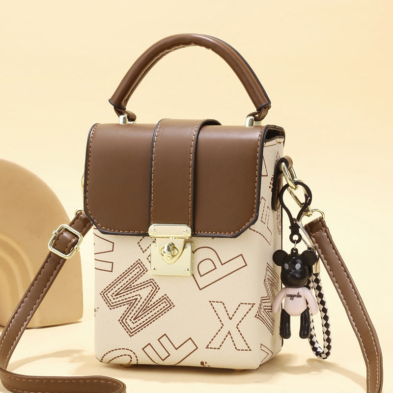 2025 new retro niche mini women's bag with simple letter printing, single shoulder handheld large capacity change phone bag