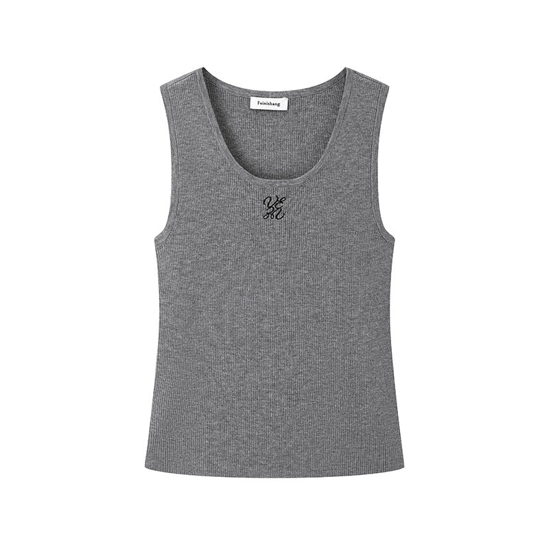 Elegant blouse with a round neckline, sleeveless, and halter neck, made from luxurious embroidered wool knit fabric.