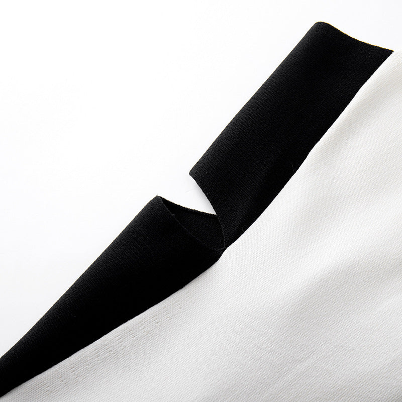 High-quality, elegant strapless, sleeveless knit dress with contrasting black and white patchwork, slimming slit, and mid-length.