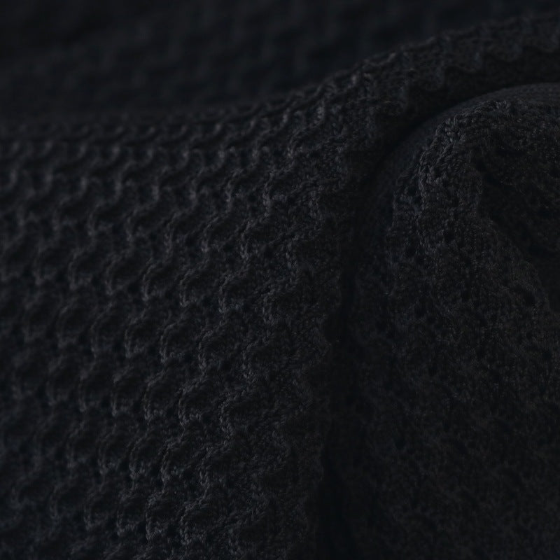 Elegant black set featuring a V-neck knit top and high-quality long high-waisted skirt