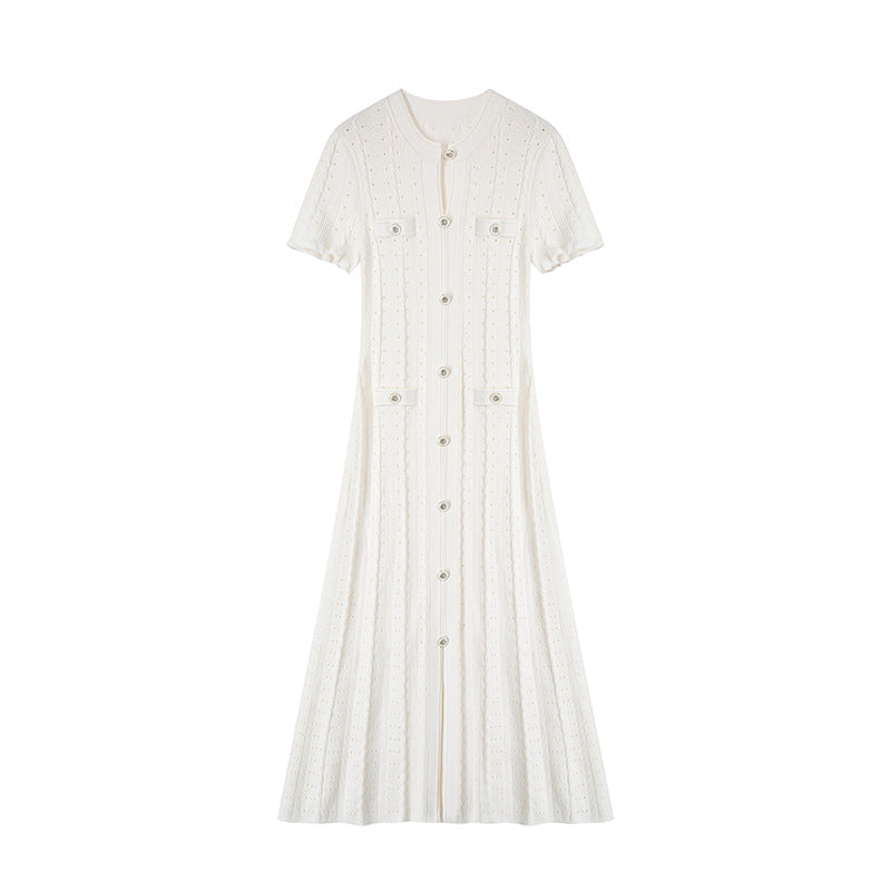 High-quality, elegant French-style dress with a round neckline, short sleeves, simple buttons, longer hem, and lace trim