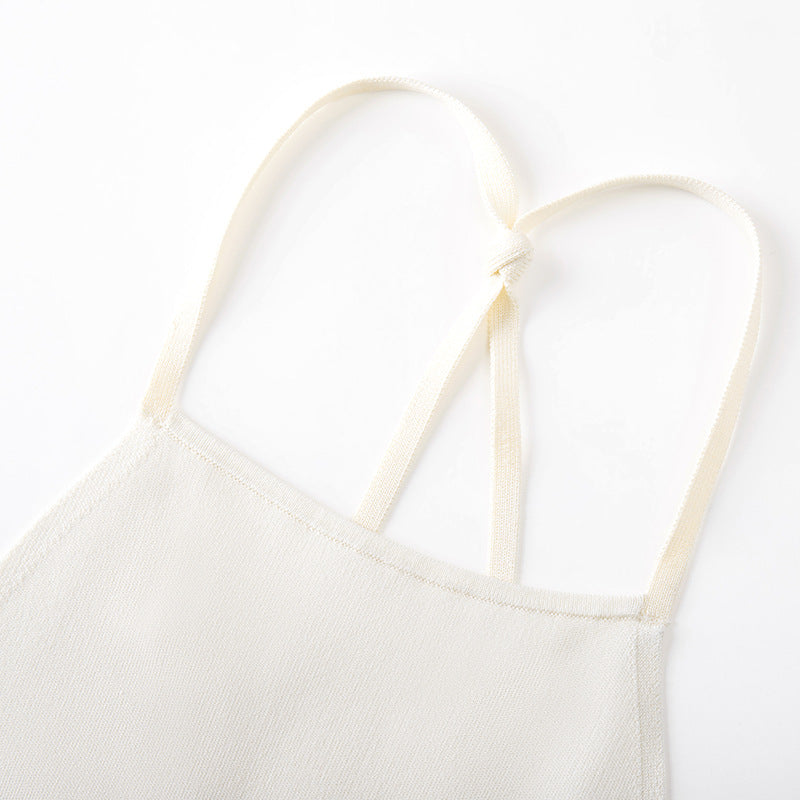 High-quality, elegant strapless, sleeveless knit dress with contrasting black and white patchwork, slimming slit, and mid-length.