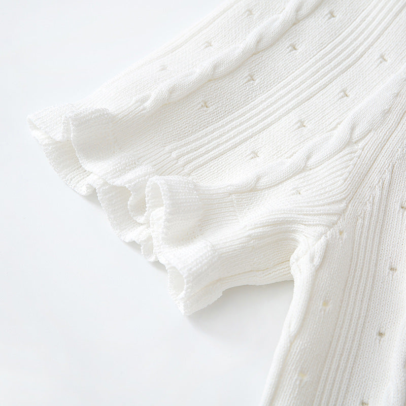 High-quality, elegant French-style dress with a round neckline, short sleeves, simple buttons, longer hem, and lace trim