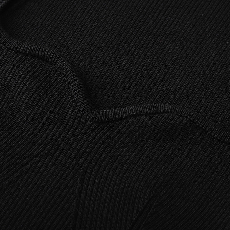 Stylish short-sleeved sweater with a heart-shaped collar, in black ribbed knit, with a slim fit