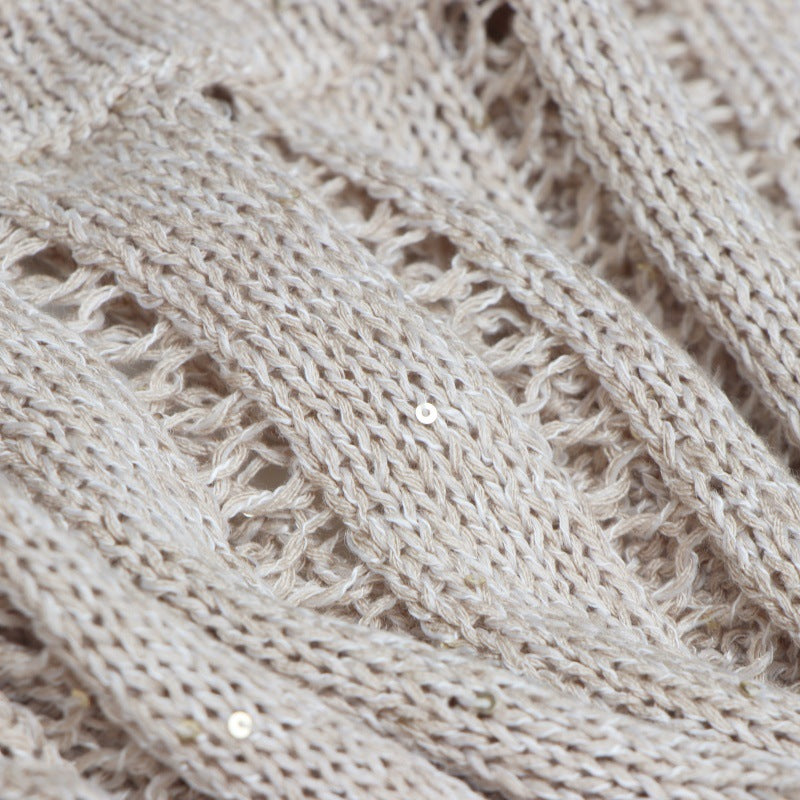 Elegant sweater with round neckline, short sleeves with linen bow and beads High-quality pullover