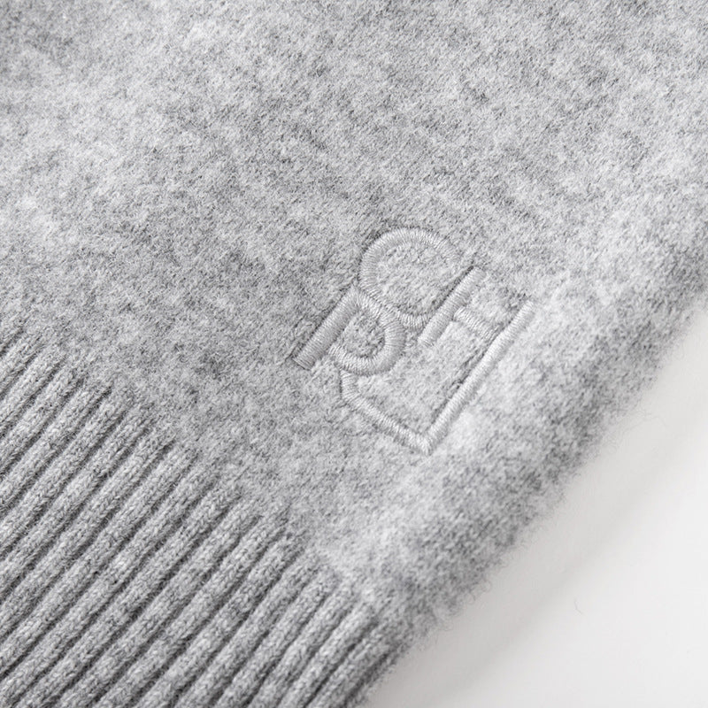 Stylish gray sweater with round neck, long sleeves, front buttons, and 100% high-quality wool