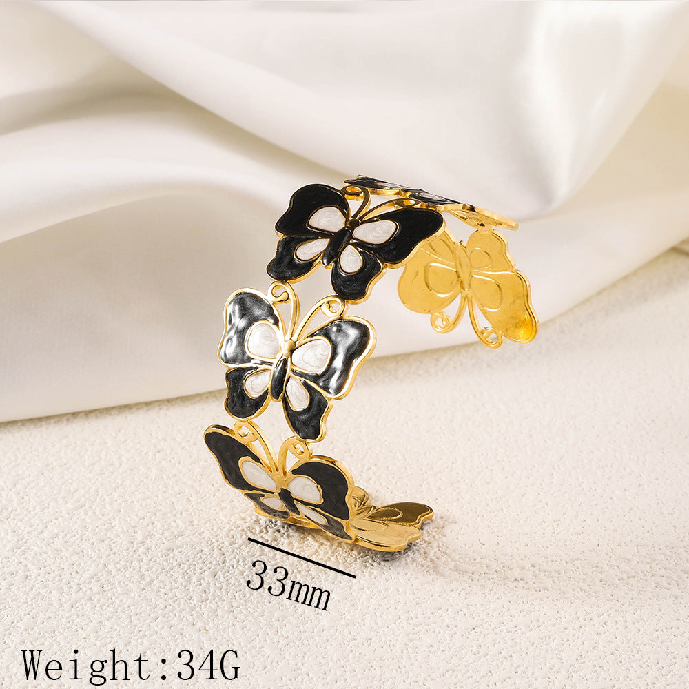 Cross border new stainless steel oil pressure painted open bracelet, exaggerated European and American women's plated 18K gold adjustable bracelet