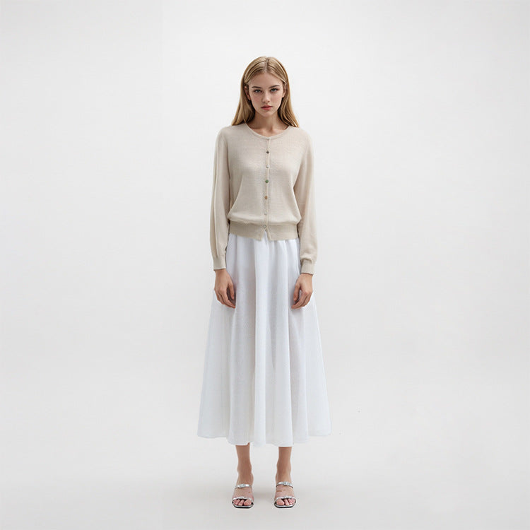 Lightweight knit jacket with a round neckline, long sleeves, and simple buttons, made from a high-quality wool and linen blend