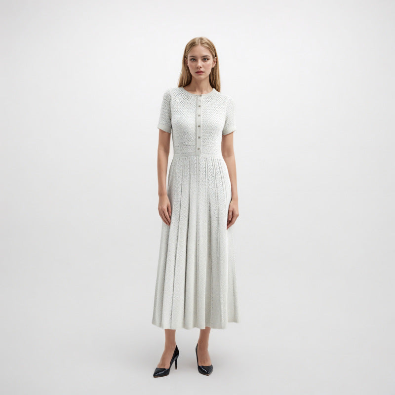 Elegant knit dress with round neckline, short sleeves, and mid-length with high-quality drawstring