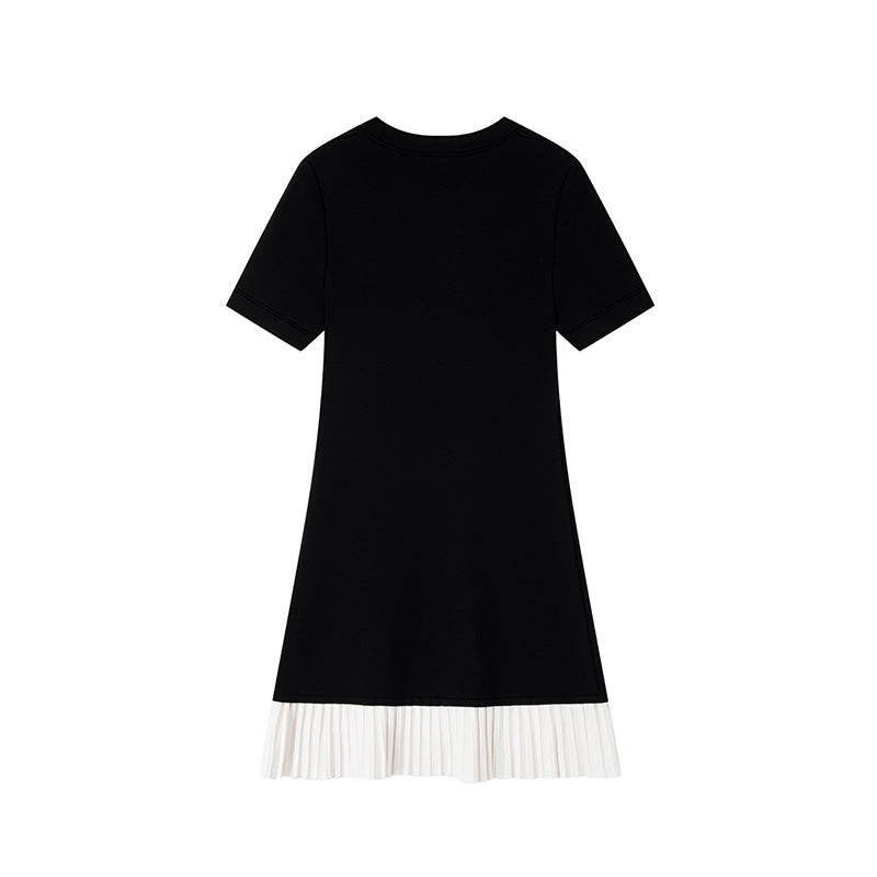 Elegant black and white French-style dress with contrasting round neckline, short sleeves, buttons, and high-quality pleats