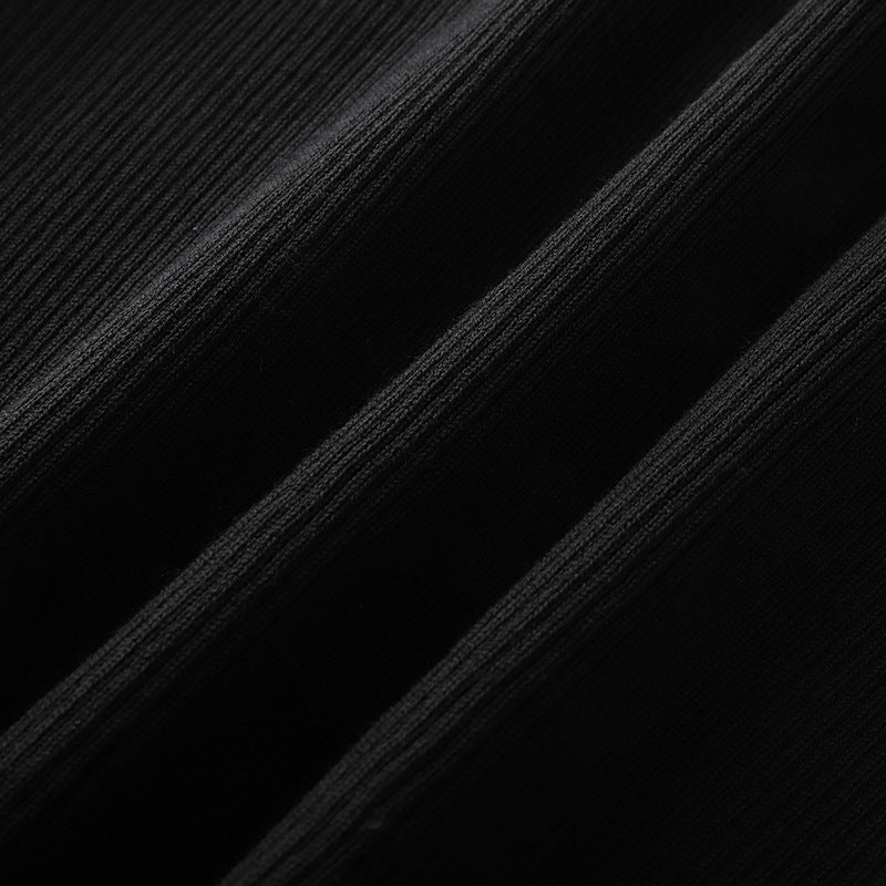 Stylish short-sleeved sweater with a heart-shaped collar, in black ribbed knit, with a slim fit