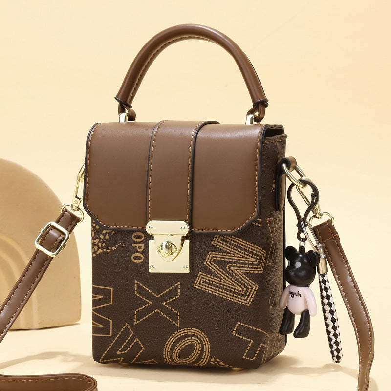 2025 new retro niche mini women's bag with simple letter printing, single shoulder handheld large capacity change phone bag