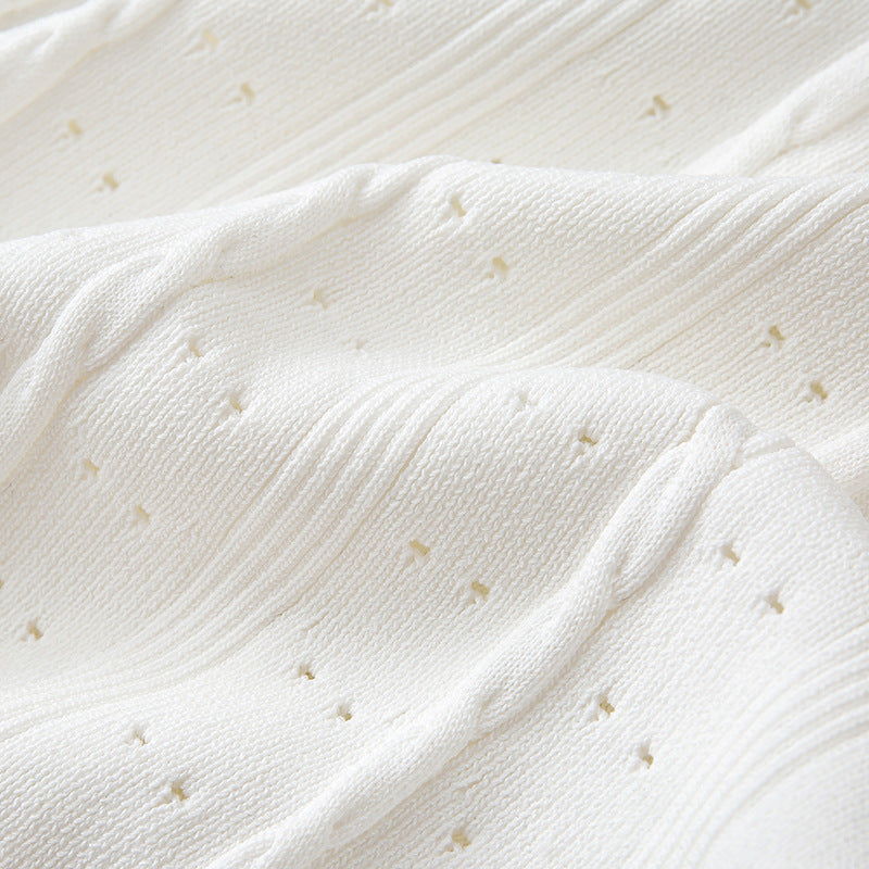 High-quality, elegant French-style dress with a round neckline, short sleeves, simple buttons, longer hem, and lace trim