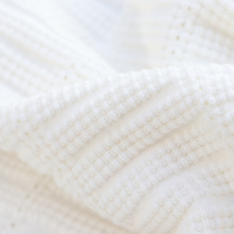 High-quality cotton knit dress with round neckline, sleeveless, with drawstrings and beads, knee length