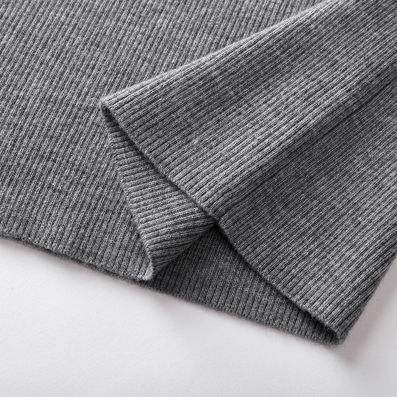 Elegant blouse with a round neckline, sleeveless, and halter neck, made from luxurious embroidered wool knit fabric.