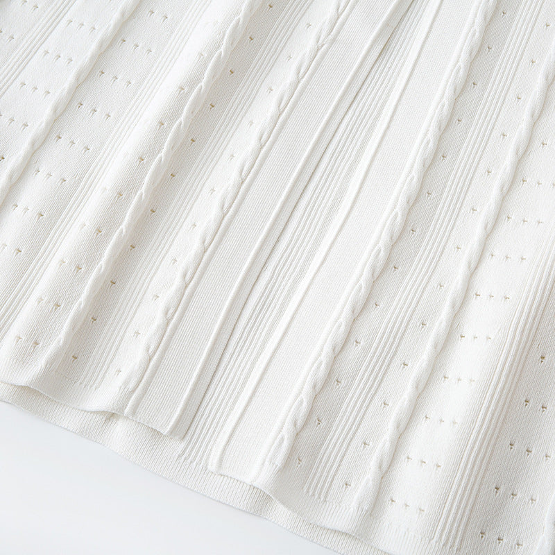 High-quality, elegant French-style dress with a round neckline, short sleeves, simple buttons, longer hem, and lace trim