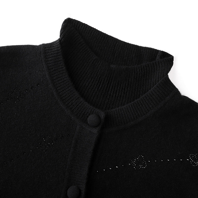 Elegant wool sweater with rhinestone print, round neckline, long sleeves, and buttons