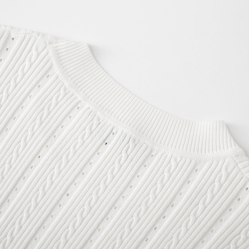 Black and white knit dress with French elegance, featuring a round neckline and high-quality short sleeves