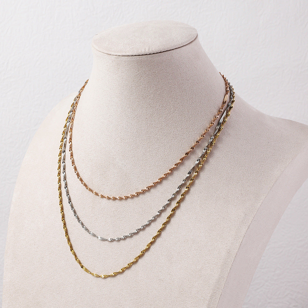 Stainless steel three-layer twisted push dense layered necklace for women, versatile plated 18K real gold lock bone chain ins titanium steel snake bone chain