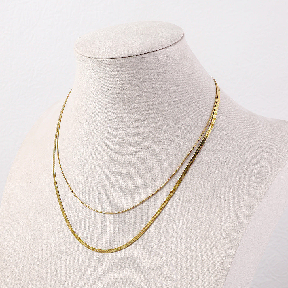 Cross border hot selling double-layer stacked blade with round snake necklace plated with 18k gold titanium steel plain chain, light luxury niche collarbone chain