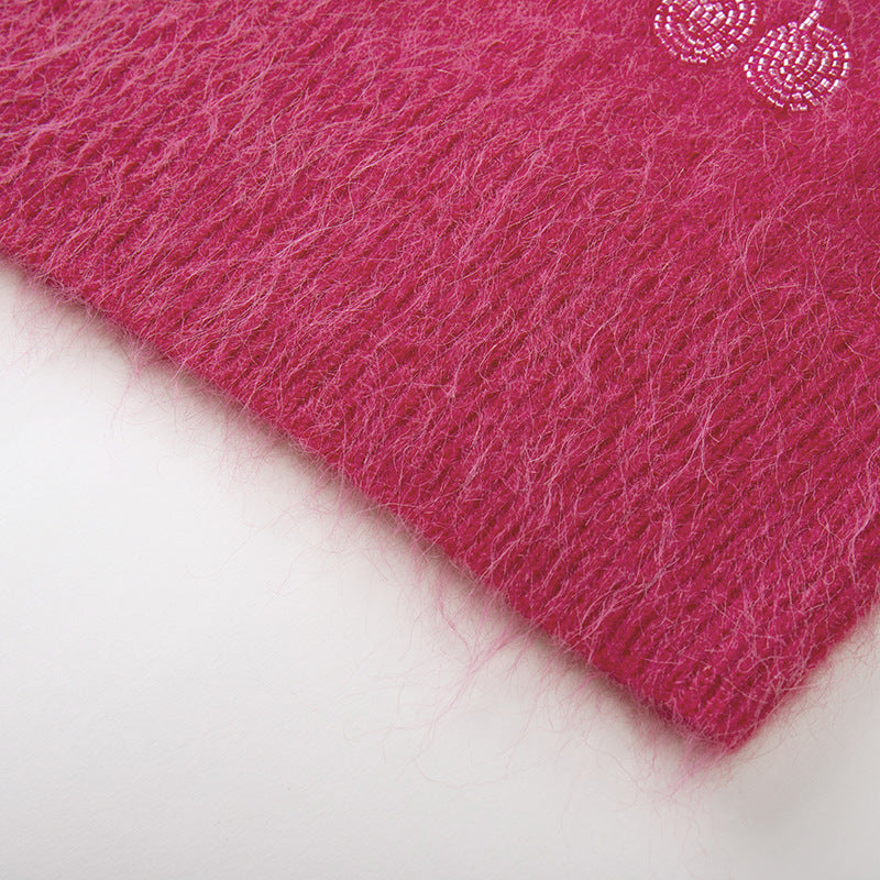 High-quality embroidered alpaca wool sweater with round neckline and long sleeves