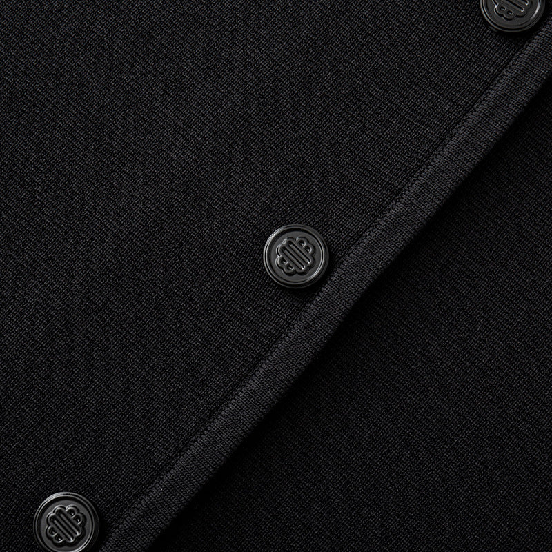 Black and white knit dress with French elegance, featuring a round neckline and high-quality short sleeves