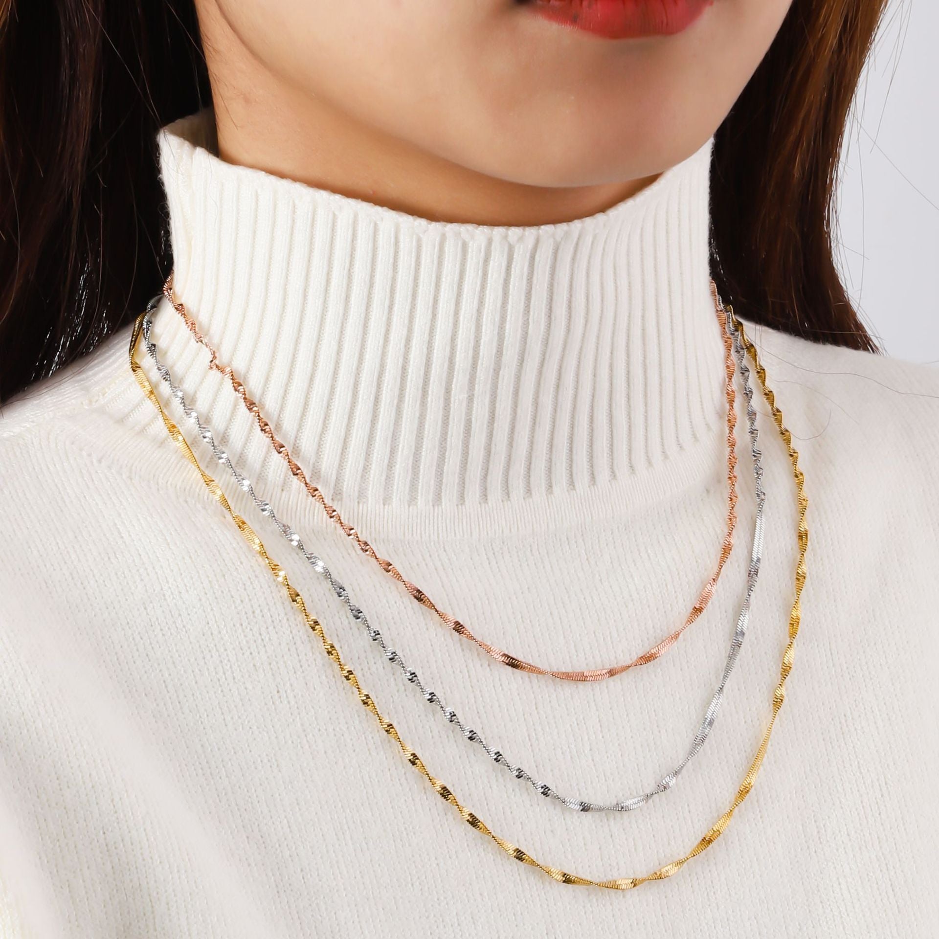 Stainless steel three-layer twisted push dense layered necklace for women, versatile plated 18K real gold lock bone chain ins titanium steel snake bone chain