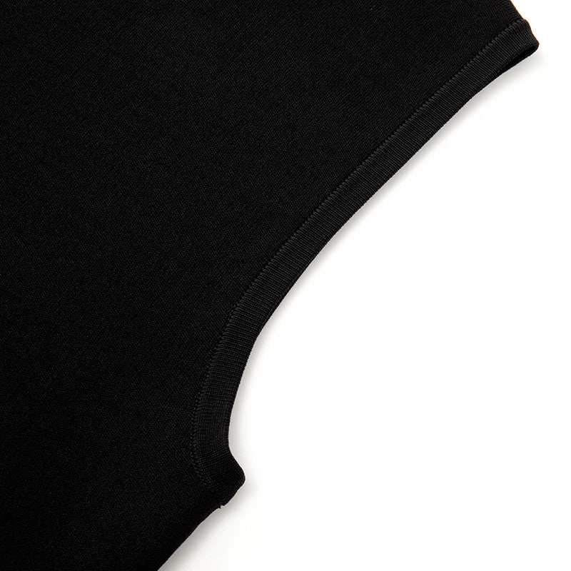 Elegant set consisting of a black sleeveless blouse with a round neckline and studs, paired with a high-waisted skirt with high-quality knit lacing