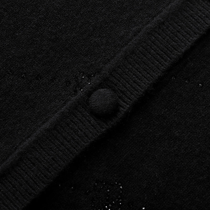 Elegant wool sweater with rhinestone print, round neckline, long sleeves, and buttons